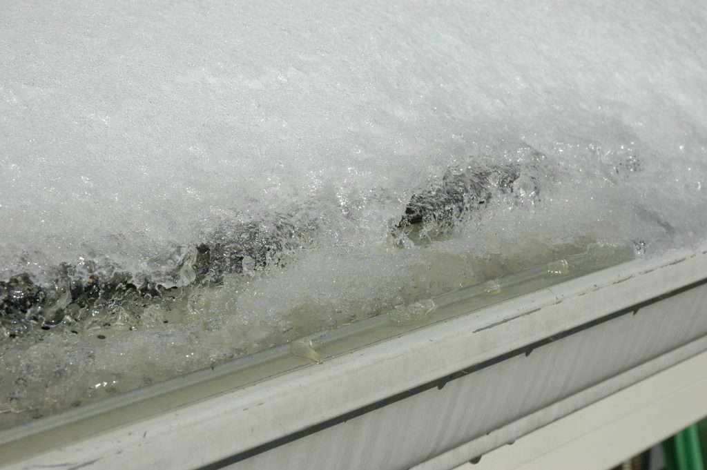 snow freezing on roof