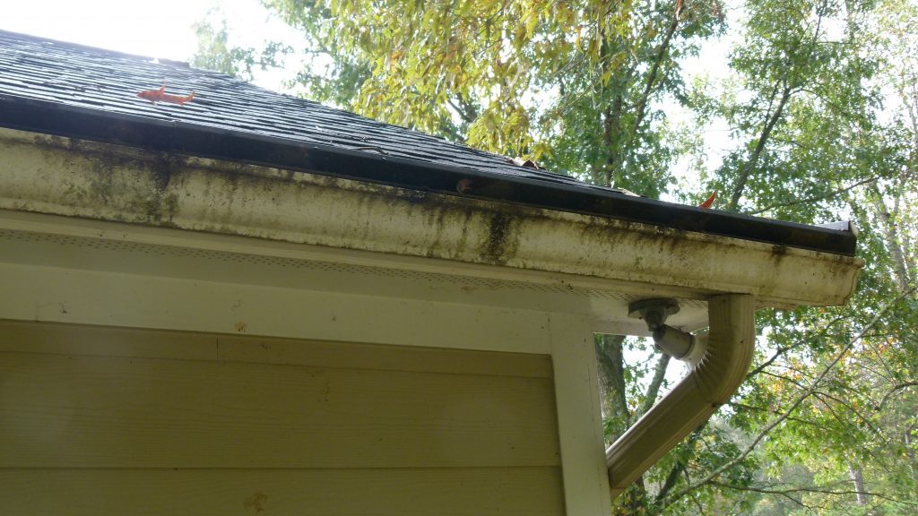 solid gutter cover with clogged opening