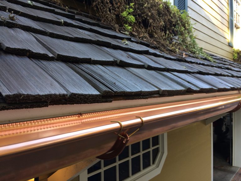half round copper gutter installed on a wood shake roof