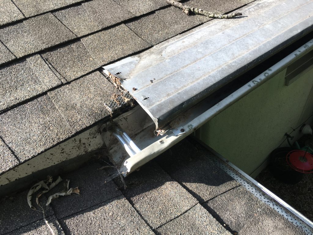 gutterhelmet with a missing end cap allows squirrels to enter and nest inside the gutters