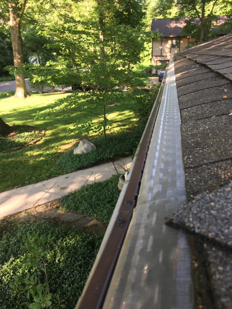 microscreen gutter guards installed on midcentury modern home in minerva park ohio.