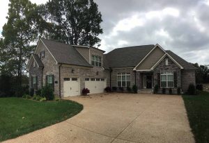 home in Nolensville, Tennessee, with 5 inch black gutters and leaf lock gutter guards