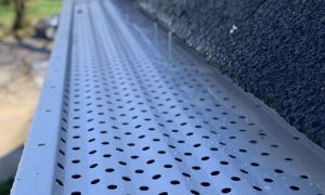 Gutter Rx perforated aluminum gutter guards in the rain