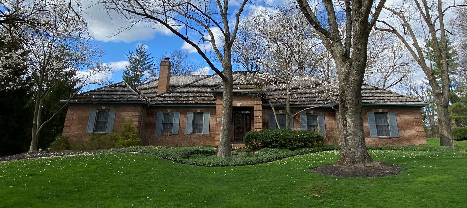 brown mastershield micro mesh gutter guards installed on a brick ranch home with cedar shingles in Columbus Ohio