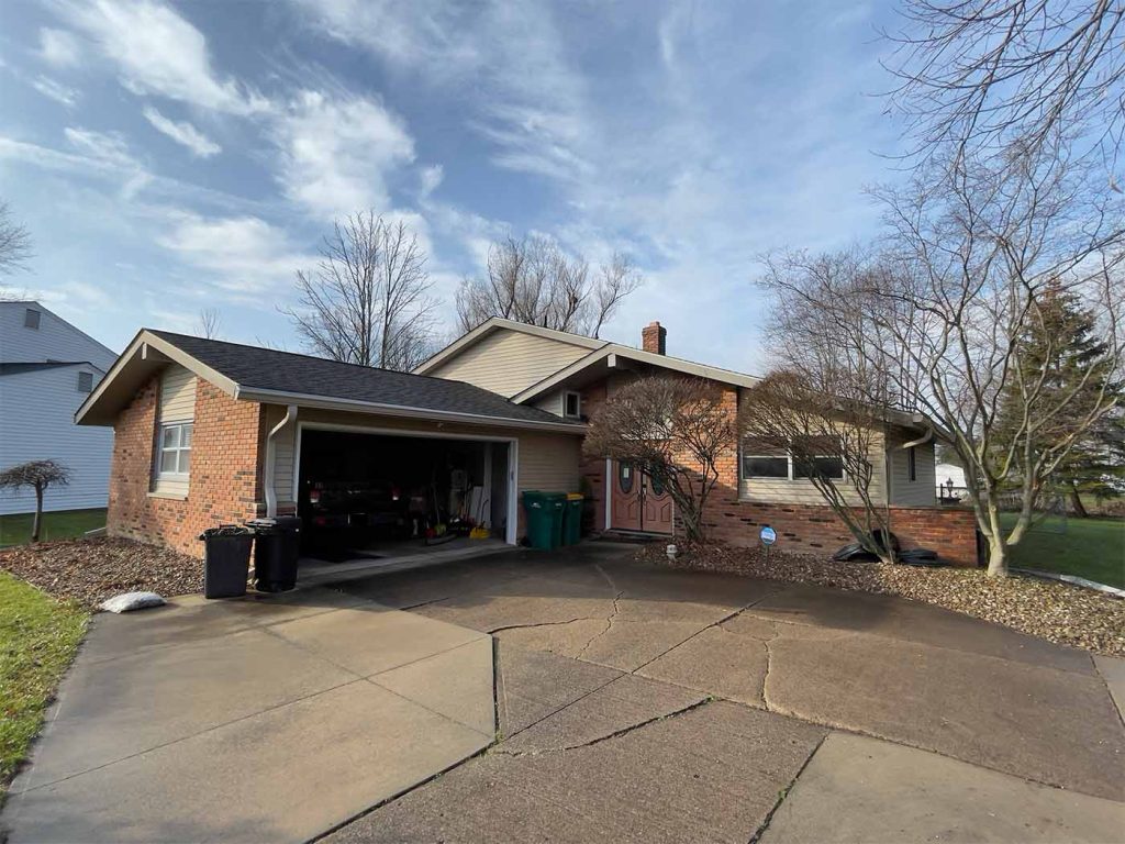 New 6-inch clay gutters and MasterShield gutter guards installed on a mid-century modern home in Mentor, Ohio