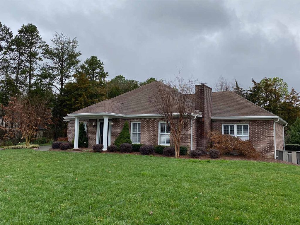 New 6" white gutters and mastershield gutter guards installed on a home in Knoxville, TN