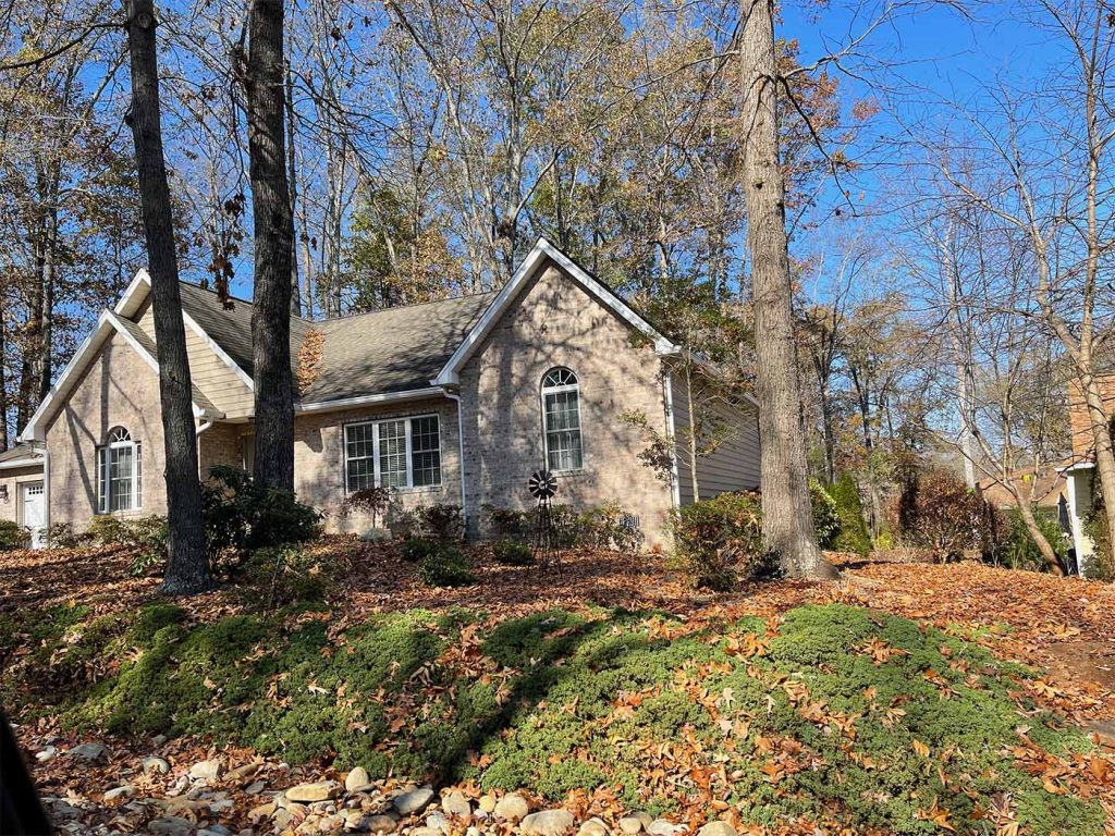 6-inch white gutters and leaflock micro mesh gutter guards installed on a home in Tellico village, TN