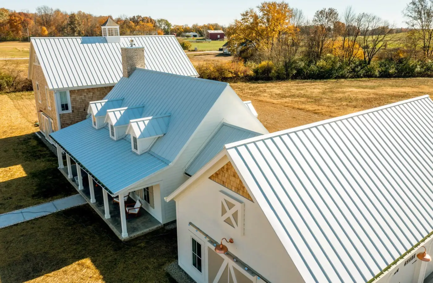 modern country farm house with silver standing seam metal roof