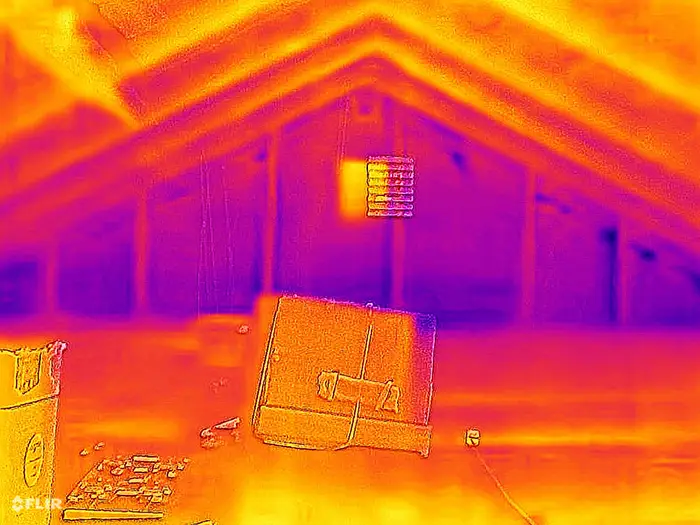 this is a thermal image photo inside an attic where heat is rising from the interior living space and fiberglass insulation has compressed to the point that it is only about 2-3 inches deep.
